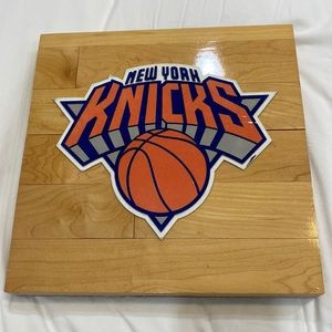 A PEICE OF THE FLOOR OF NEW TORK KNICKS STADIUM